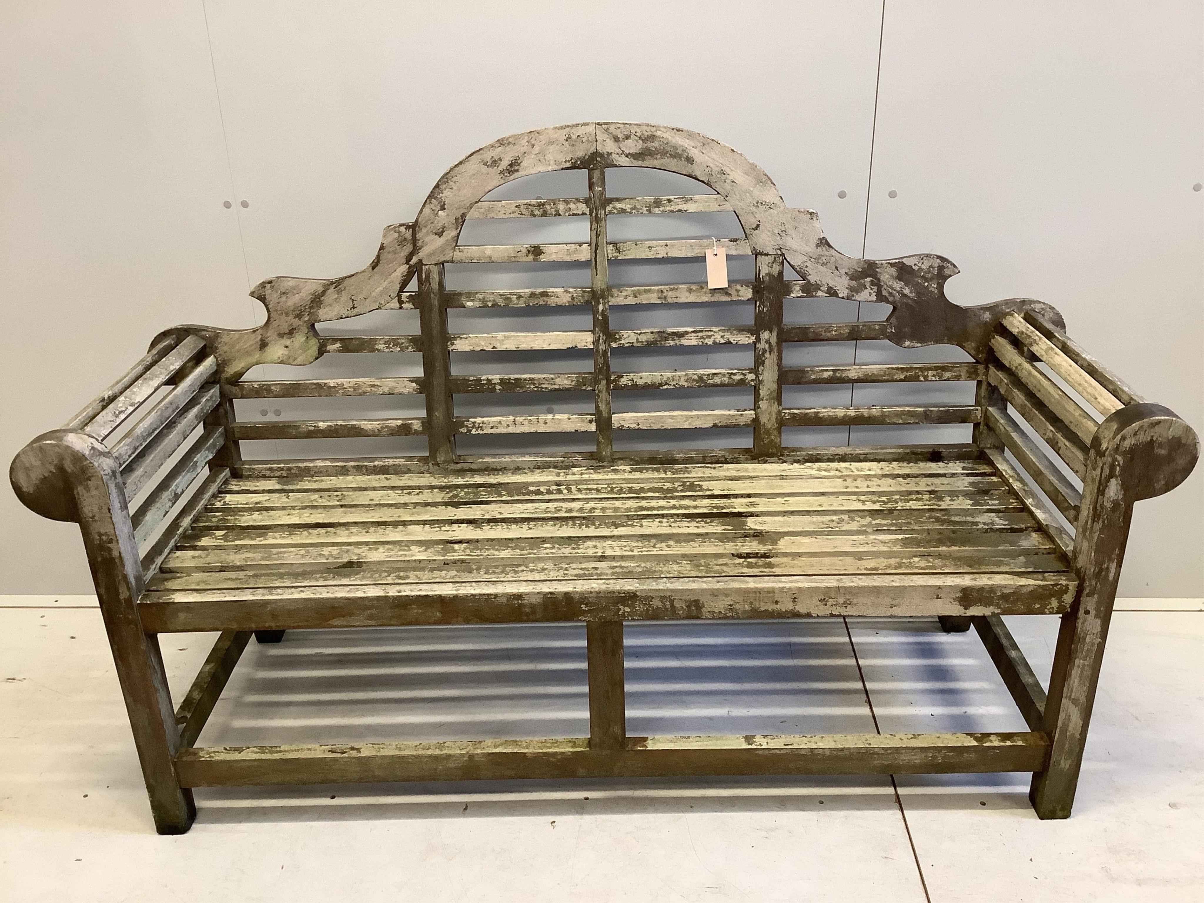 A Lutyens style weathered teak garden bench, width 165cm, depth 57cm, height 104cm. Condition - fair